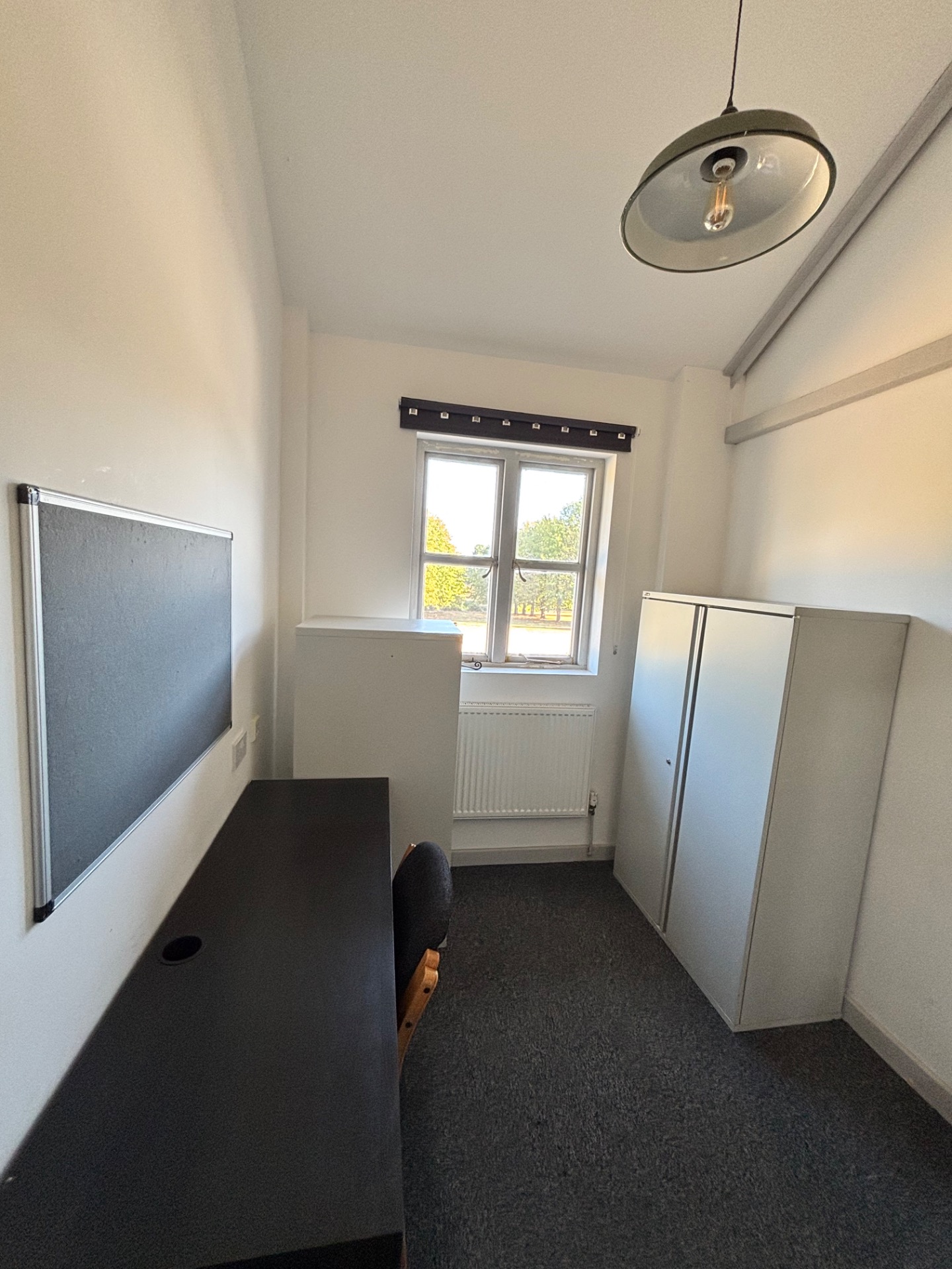 Office C is complete with basic office furniture including: 1 desk with storage, 2 chairs, 1 filing cabinet, 1 large cabinet, 1 pinboard and a waste bin.